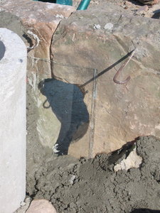 53 . A SHEET OF GLASS STOPS THE RUBBLE FROM POURING OUT OF THE HOLE
